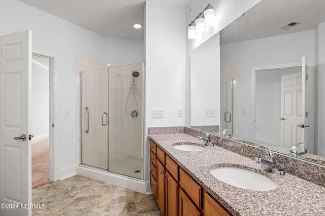 bathroom featuring walk in shower and vanity