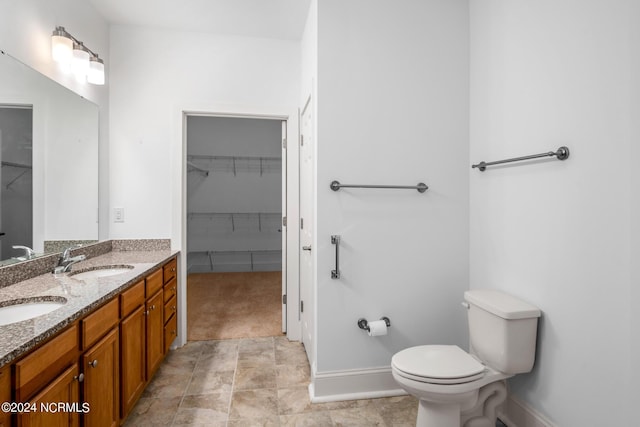 bathroom with toilet and vanity