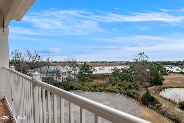 balcony featuring a water view