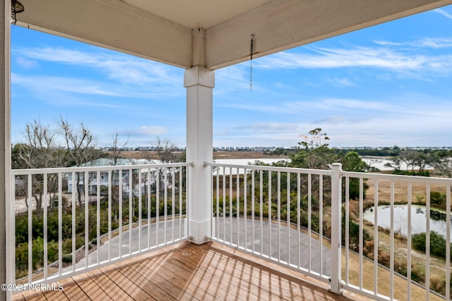 balcony featuring a water view