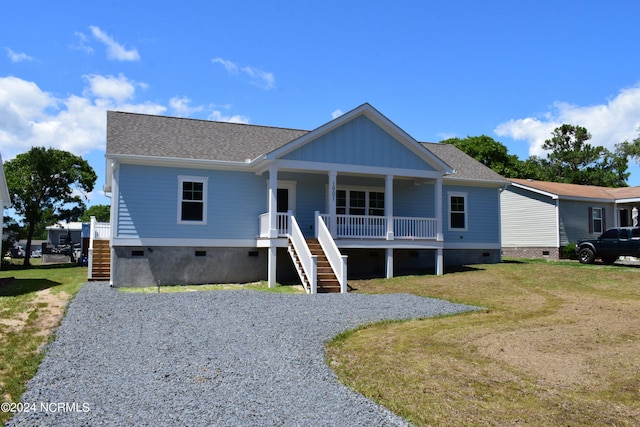 view of front of property with a front yard and a porch