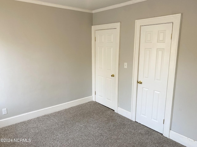 1306 N Respess St, Washington, NC 27889 - unfurnished bedroom with carpet floors, ornamental molding, and baseboards
