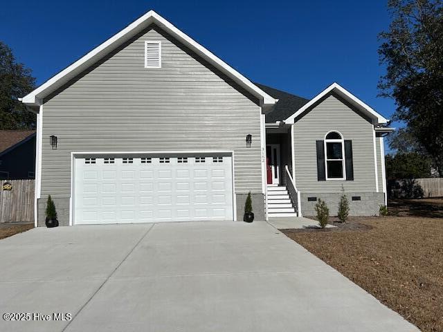 ranch-style home featuring a garage