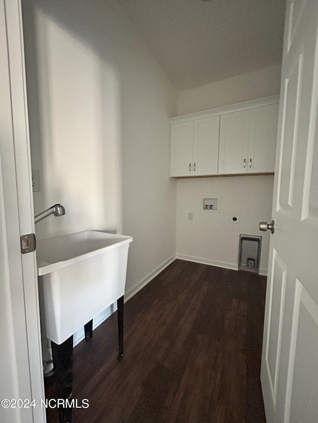 laundry room with cabinets, hookup for a washing machine, dark hardwood / wood-style flooring, electric dryer hookup, and sink