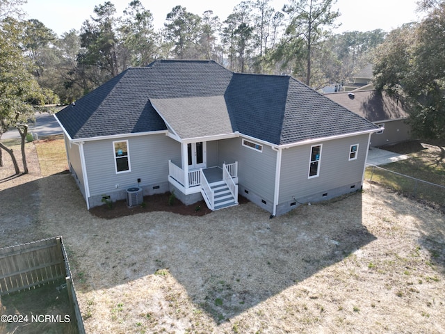 rear view of property featuring central AC unit and a deck