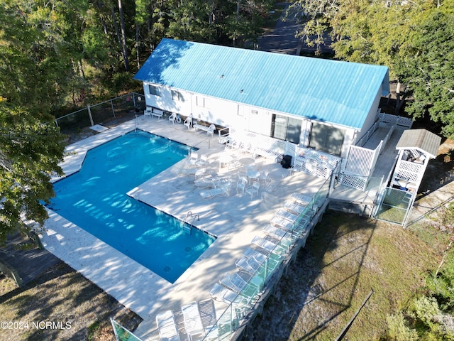 view of swimming pool featuring a patio area