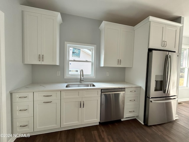 kitchen featuring white cabinetry, sink, and appliances with stainless steel finishes