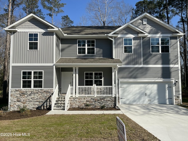 view of front of property with a garage, covered porch, board and batten siding, and concrete driveway