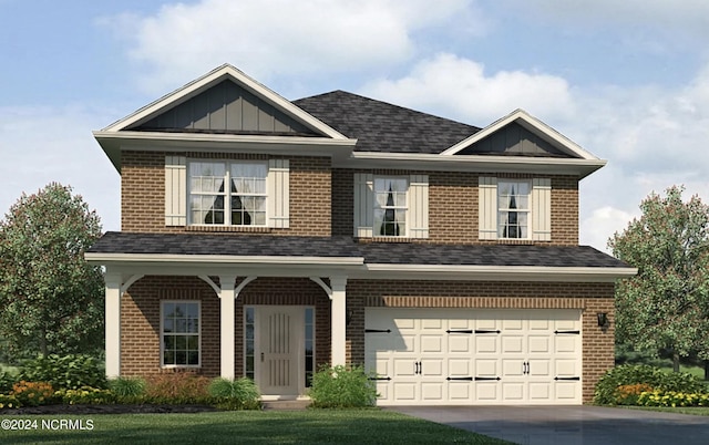 view of front of property with a garage and a front lawn