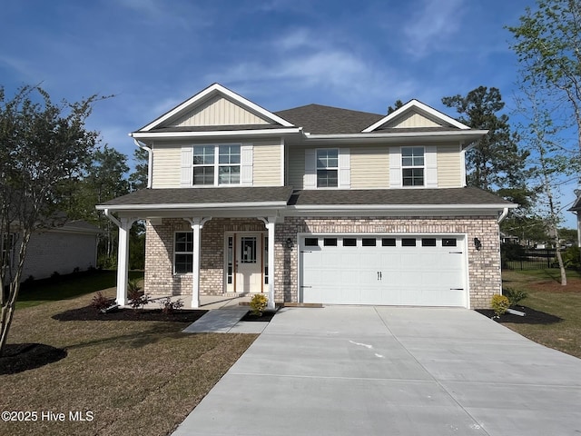 1224 Mandevilla Dr SE, Bolivia, NC 28422 - view of front of house with concrete driveway, brick siding, covered porch, an attached garage, and a shingled roof
