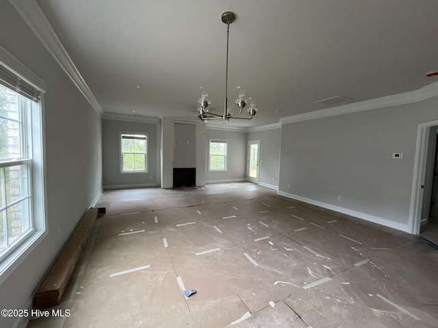 1224 Mandevilla Dr SE, Bolivia, NC 28422 - unfurnished living room with a chandelier, crown molding, and baseboards