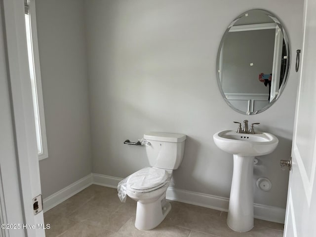 1224 Mandevilla Dr SE, Bolivia, NC 28422 - half bath with toilet, tile patterned flooring, and baseboards
