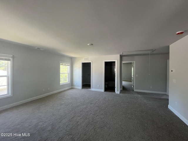 1224 Mandevilla Dr SE, Bolivia, NC 28422 - unfurnished bedroom featuring attic access, baseboards, two closets, and carpet