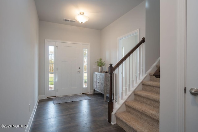 1224 Mandevilla Dr SE, Bolivia, NC 28422 - foyer entrance with dark wood-type flooring, stairs, and baseboards