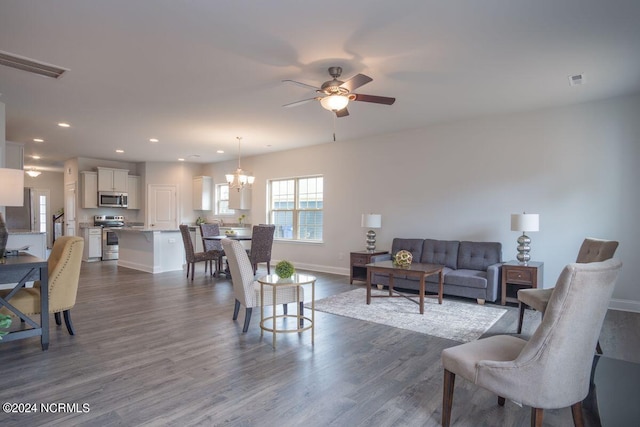 1224 Mandevilla Dr SE, Bolivia, NC 28422 - living area with ceiling fan, dark wood-type flooring, baseboards, recessed lighting, and a chandelier