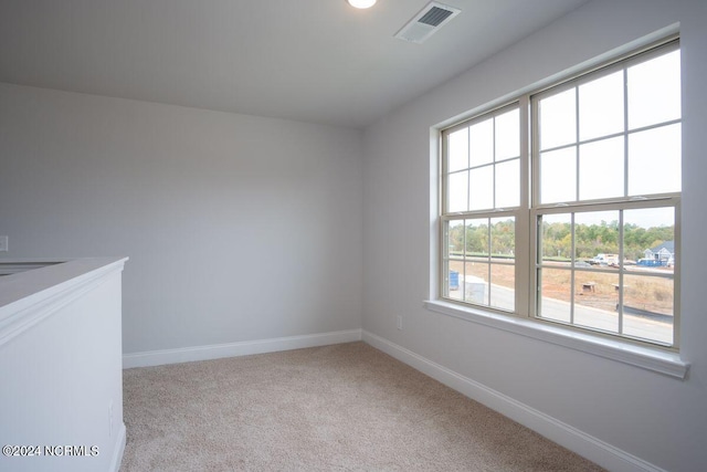 1224 Mandevilla Dr SE, Bolivia, NC 28422 - carpeted empty room featuring healthy amount of natural light and baseboards