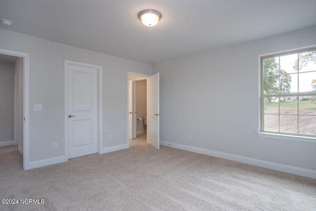 1224 Mandevilla Dr SE, Bolivia, NC 28422 - unfurnished bedroom featuring light carpet and baseboards