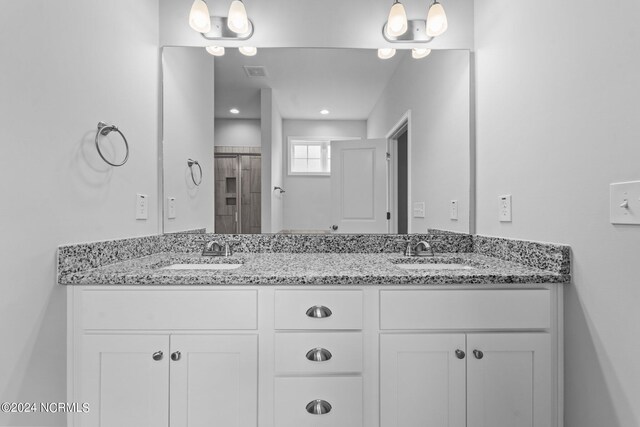 bathroom with dual vanity