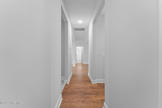 hall featuring wood-type flooring