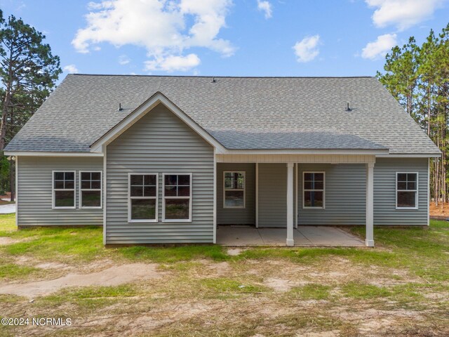 back of house with a patio area