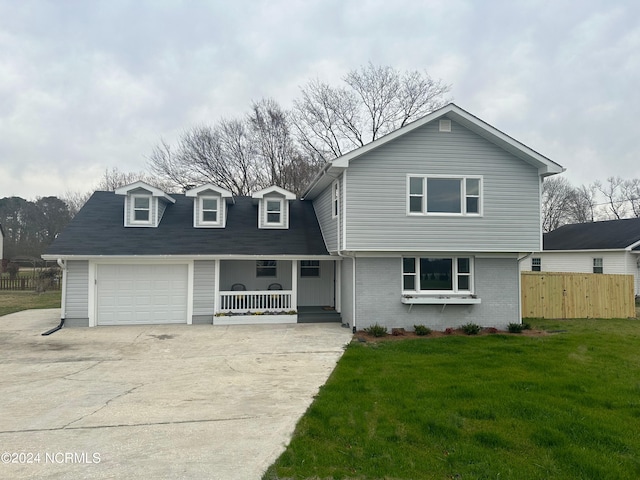 view of front property with a front yard and a garage