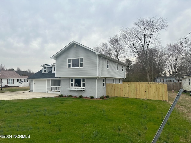 rear view of property with a yard