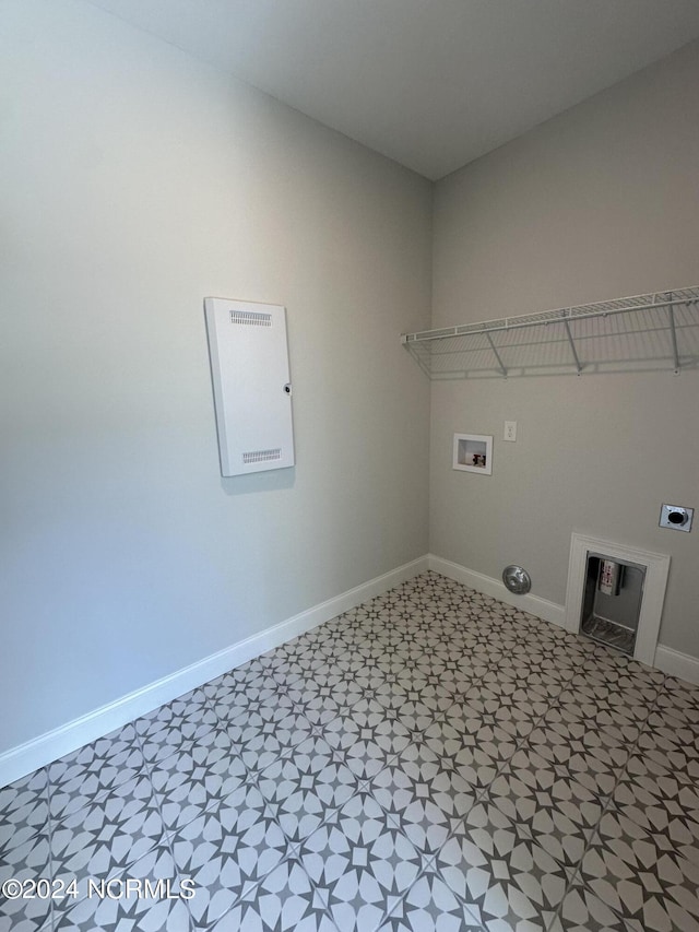 washroom featuring hookup for a washing machine, electric dryer hookup, laundry area, baseboards, and tile patterned floors