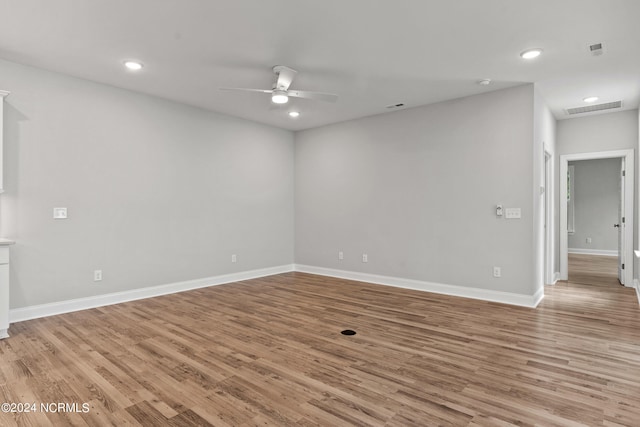 empty room featuring light hardwood / wood-style flooring and ceiling fan