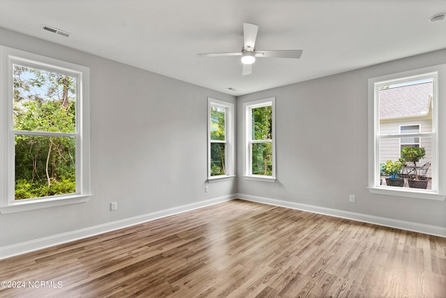 empty room featuring light hardwood / wood-style flooring and ceiling fan