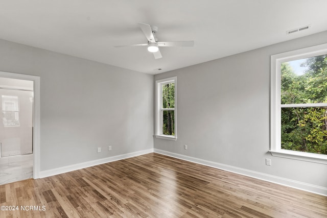 unfurnished room featuring ceiling fan and wood-type flooring