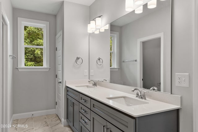 bathroom featuring tile patterned floors and double sink vanity