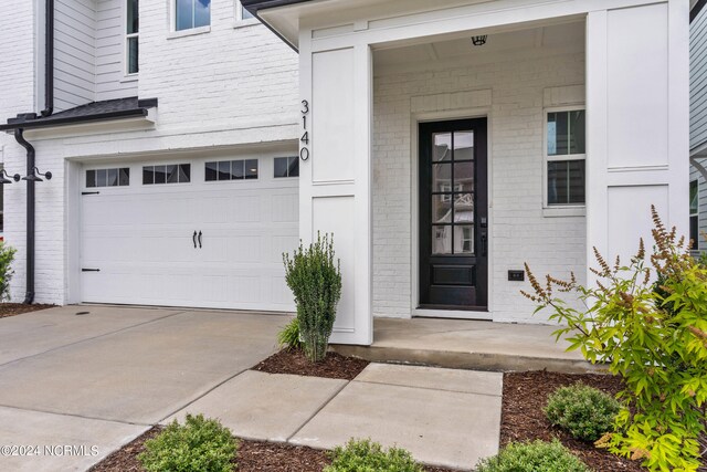 property entrance with a garage