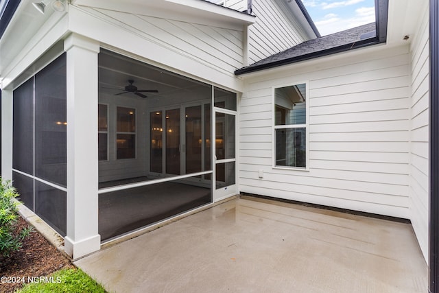 view of patio with a sunroom and ceiling fan