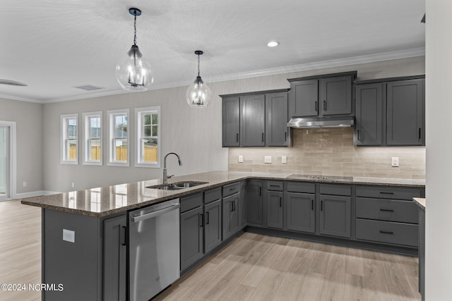 kitchen with dishwasher, backsplash, sink, light hardwood / wood-style flooring, and decorative light fixtures