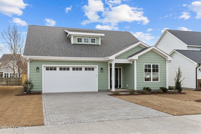 view of front of property with a garage