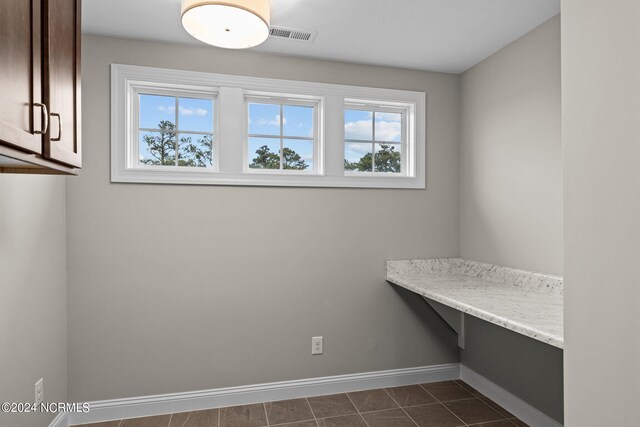 washroom featuring dark tile patterned floors