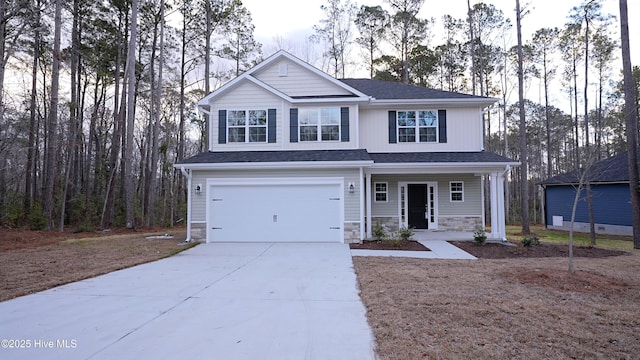 view of property with a porch and a garage