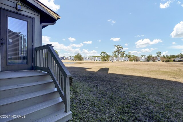 rear view of house with a lawn