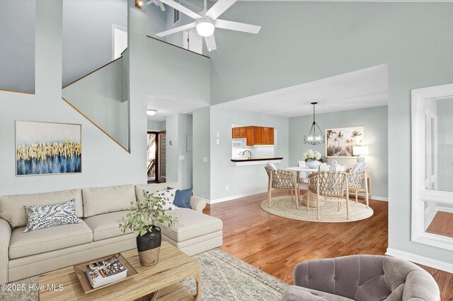 empty room featuring plenty of natural light, dark hardwood / wood-style floors, and vaulted ceiling