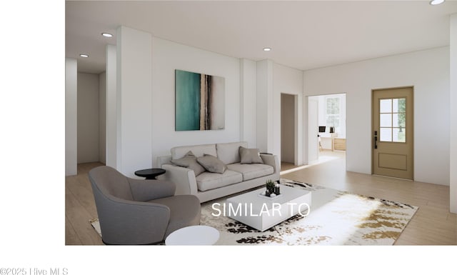 living room featuring light wood finished floors and recessed lighting