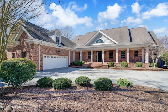 view of front facade featuring a porch and a garage