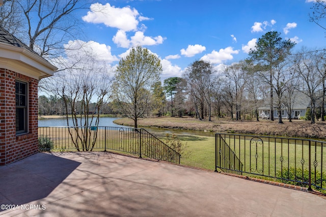 view of patio with a water view