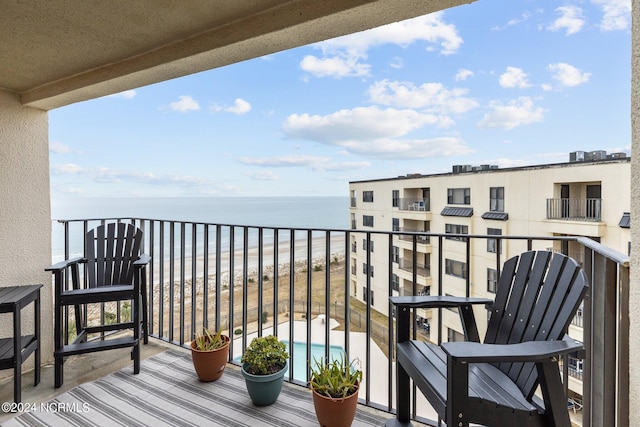 balcony featuring a water view