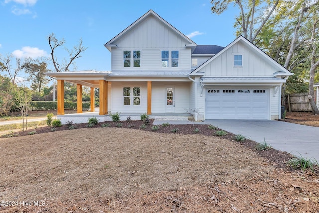 view of front of house featuring covered porch and a garage