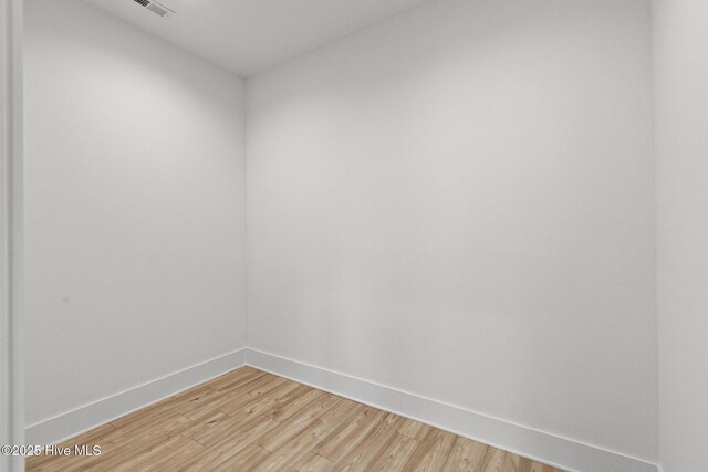 empty room with light hardwood / wood-style floors