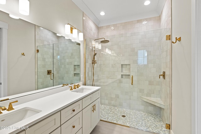 bathroom with tile patterned floors, vanity, and a shower with shower door