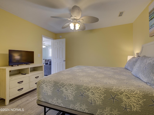 bedroom featuring light hardwood / wood-style flooring and ceiling fan