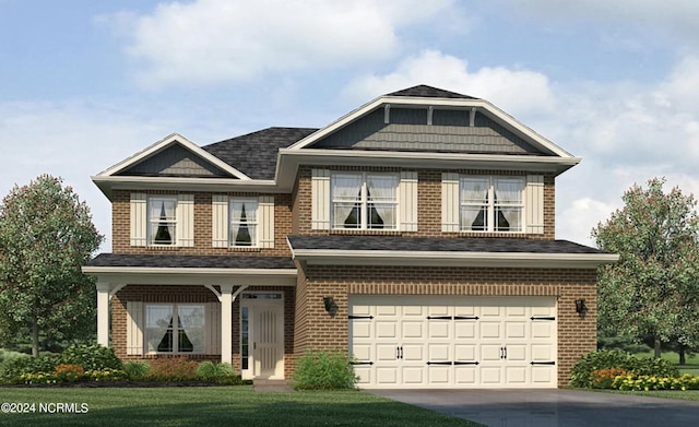 view of front facade with a garage and a front yard