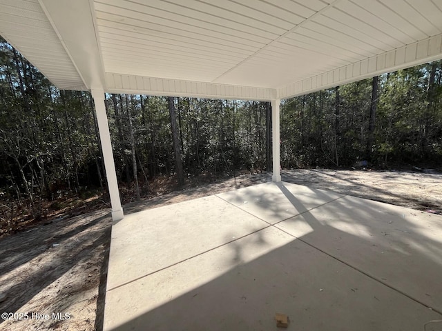 1225 Mandevilla Dr SE, Bolivia, NC 28422 - view of patio / terrace featuring a wooded view