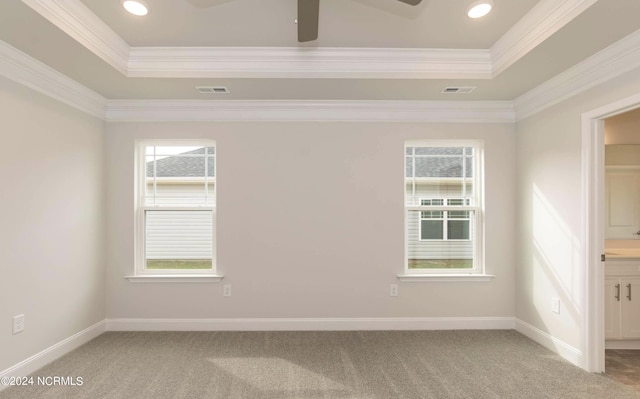 1225 Mandevilla Dr SE, Bolivia, NC 28422 - spare room featuring a tray ceiling, light carpet, ceiling fan, crown molding, and recessed lighting